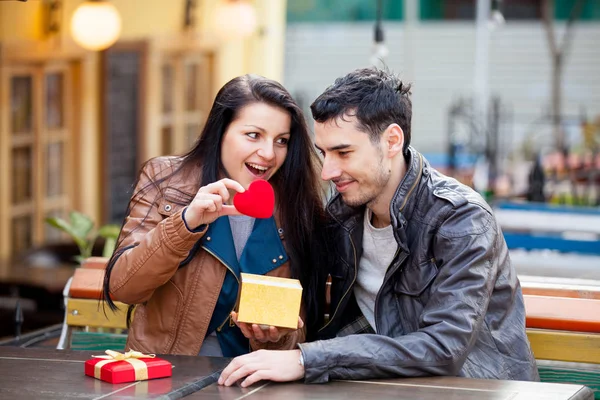 Cute couple with heart shaped toy — Stock Photo, Image