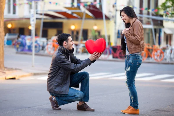 Cute couple with heart shaped toy — Stock Photo, Image