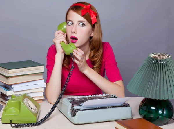 Photo of beautiful young secretary talking on the phone on the w — Stock Photo, Image