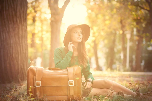 Photo of beautiful young woman with suitcase on the wonderful au — Stock Photo, Image