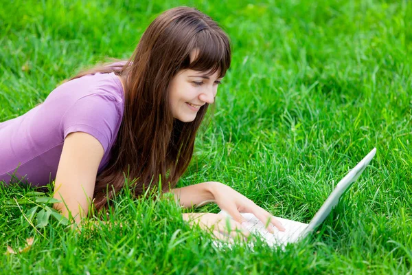 Beautiful young woman with laptop — Stock Photo, Image