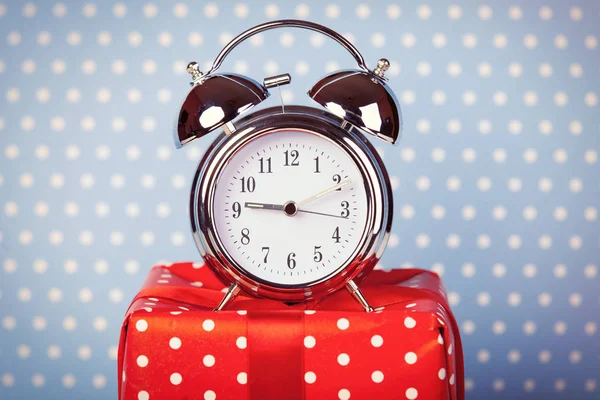 Alarm clock and cute gift — Stock Photo, Image