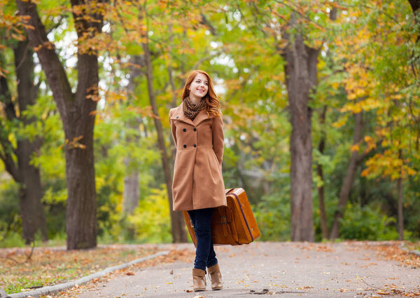 beautiful young woman with suitcase