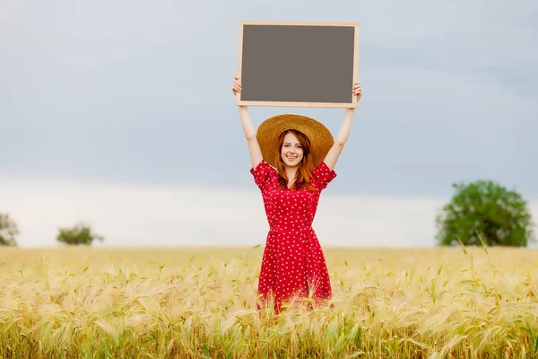 Beautiful young woman holding board — Stock Photo, Image