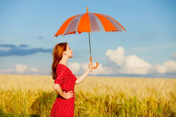 Beautiful young woman with umbrella — Stock Photo, Image