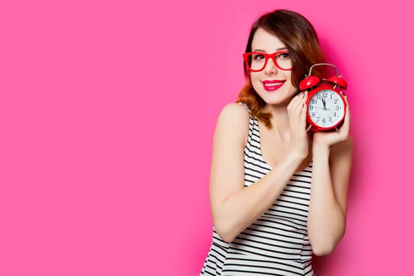 Beautiful young woman with alarm clock — Stock Photo, Image