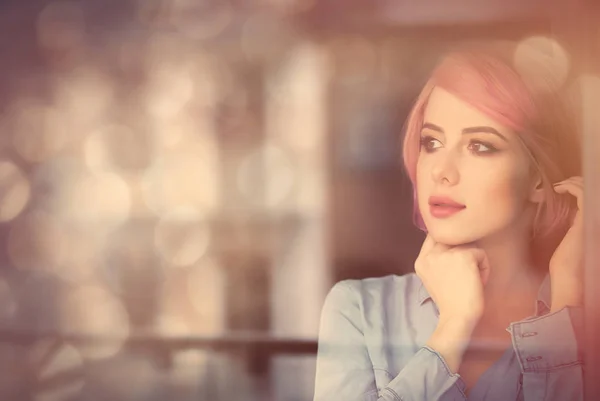 Woman looking at the window — Stock Photo, Image