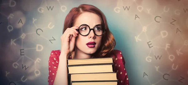 Beautiful young woman with pile of books on the wonderful blue b — Stock Photo, Image