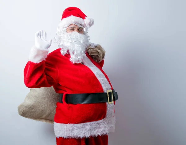 Lustiger Weihnachtsmann mit Sack — Stockfoto