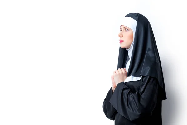 Young serious nun with cross — Stock Photo, Image