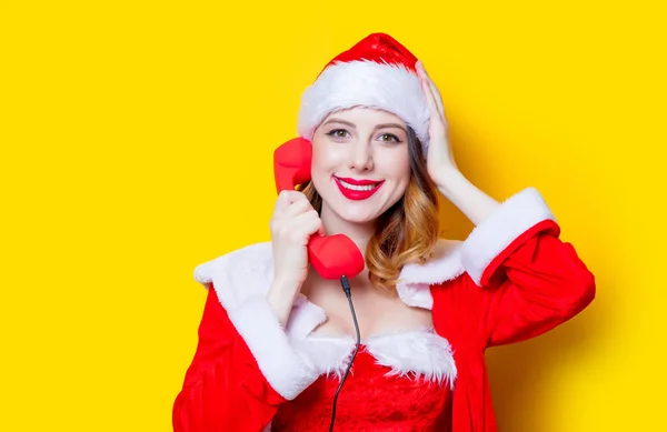 Santa  girl in red clothes with handset — Stock Photo, Image