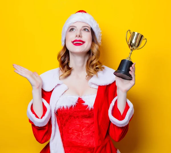 Santa dívka s trofejí pro vítěze — Stock fotografie