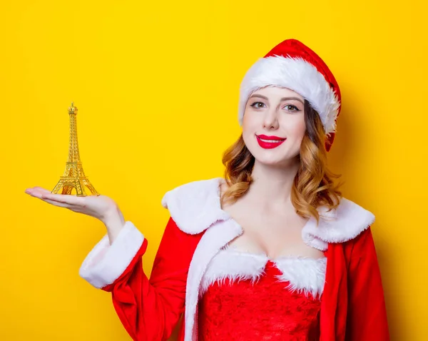 Santa dívka s darem Eiffelova věž — Stock fotografie