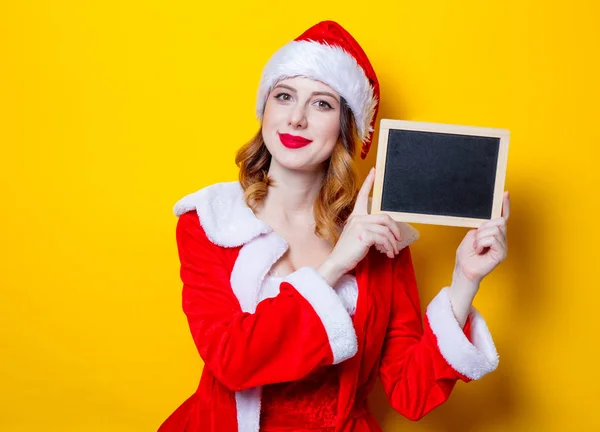 Santa chica en ropa roja con tabla — Foto de Stock