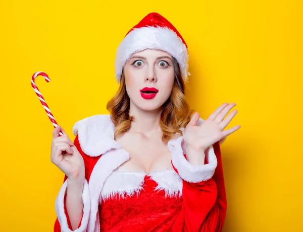 Santa  girl in red clothes with candy — Stock Photo, Image