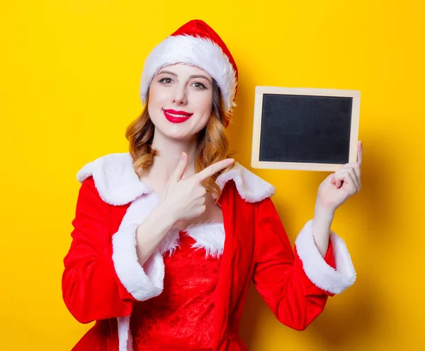 Santa girl in red clothes with board — Stock Photo, Image