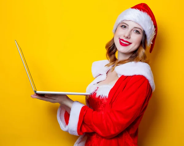 Santa menina com computador portátil — Fotografia de Stock