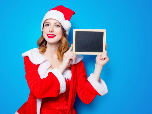 Santa chica en ropa roja con tabla — Foto de Stock