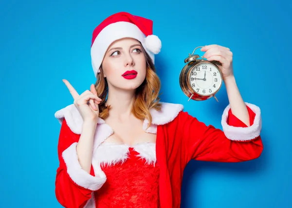 Santa  girl in red clothes with  alarm clock — Stock Photo, Image