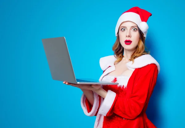 Santa menina com computador portátil — Fotografia de Stock