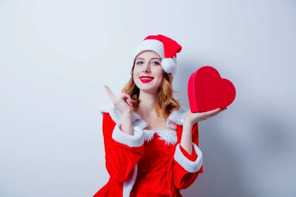 Santa  girl with heart shape gift — Stock Photo, Image