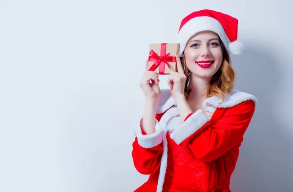 Santa girl in red clothes with gift box — Stock Photo, Image