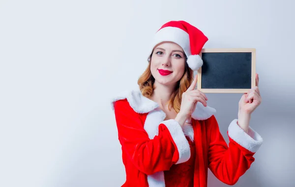 Santa chica en el tablero de ropa roja —  Fotos de Stock