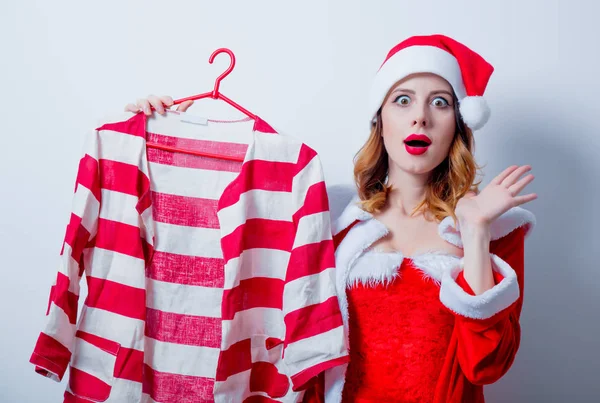 Santa chica en ropa roja con camisa —  Fotos de Stock