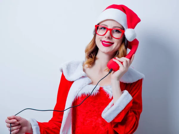 Santa girl avec lunettes et combiné — Photo