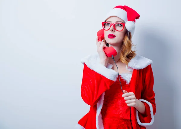 Santa meisje met bril en handset — Stockfoto