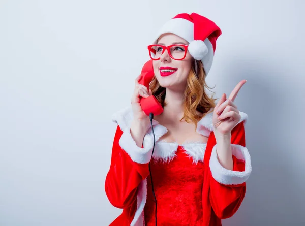 Santa  girl with eyeglasses and handset — Stock Photo, Image