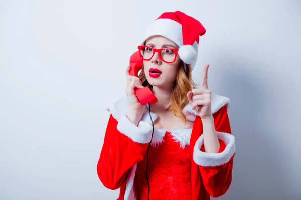 Santa  girl with eyeglasses and handset — Stock Photo, Image