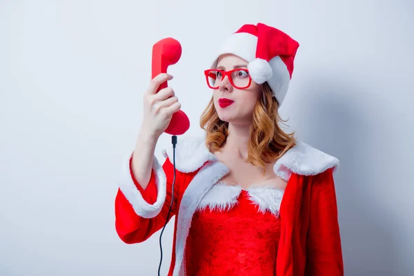 Santa girl with eyeglasses and handset — Stock Photo, Image