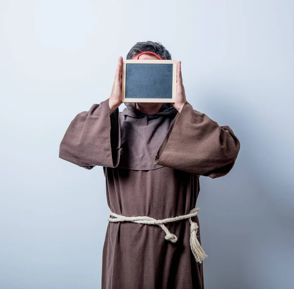 Catholic monk with board — Stock Photo, Image