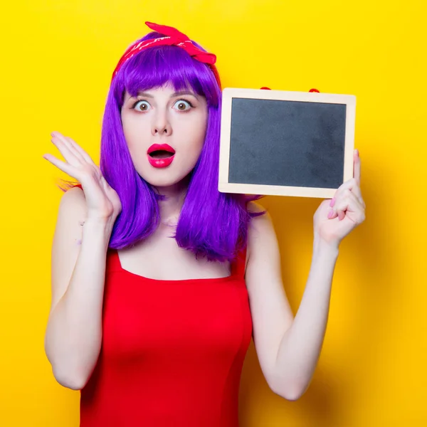 Young woman with blackboard — Stock Photo, Image