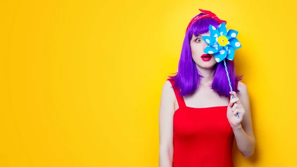 Young woman with pinwheel toy — Stock Photo, Image