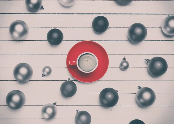 Coffee cup and christmas balls — Stock Photo, Image