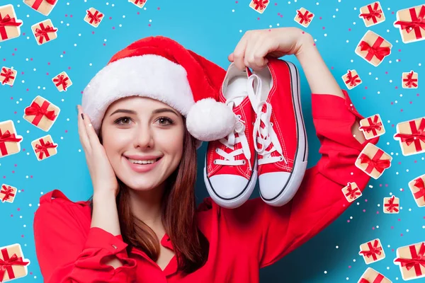Young woman with gumshoes — Stock Photo, Image