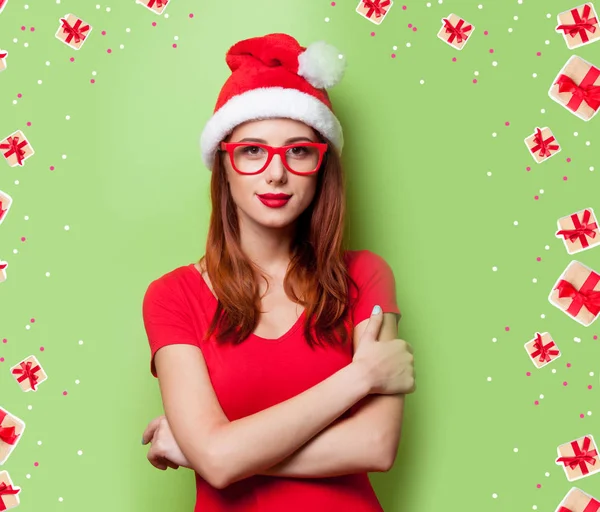 Redhead woman in christmas hat — Stock Photo, Image