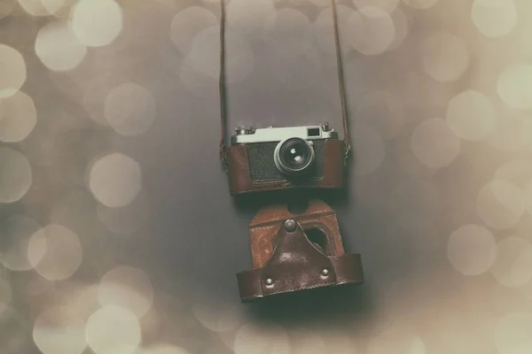 Retro camera in leather case — Stock Photo, Image