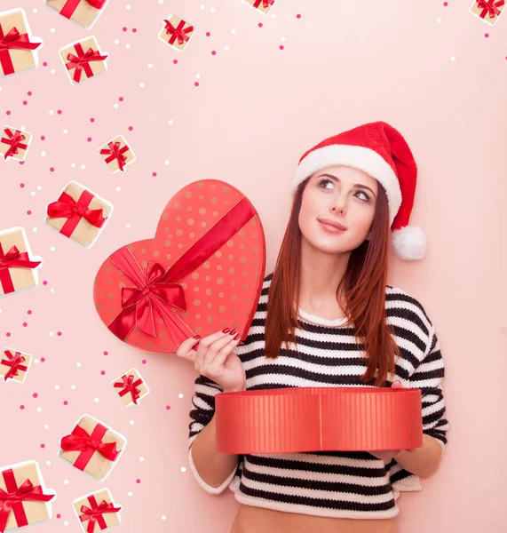 Meisje in de kerstman hoed — Stockfoto