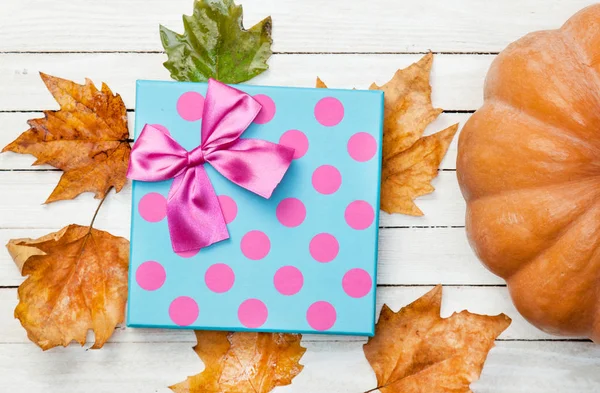 Pumpkin and dry leaves — Stock Photo, Image