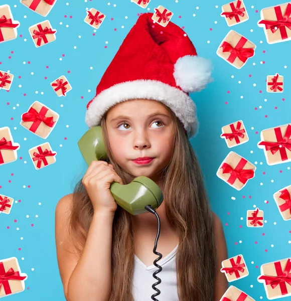 Young girl in Santa hat — Stock Photo, Image