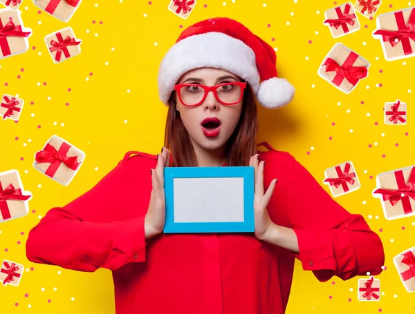 Young woman with photo frame — Stock Photo, Image