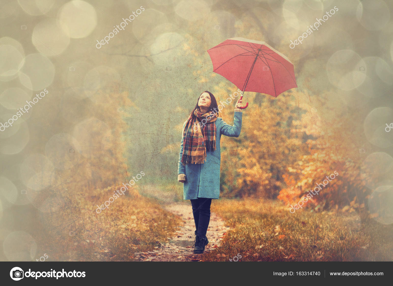 girl with umbrella Stock Photo by ©massonforstock 163314740