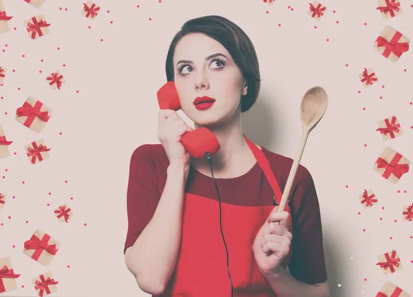 Young housewife with spoon — Stock Photo, Image