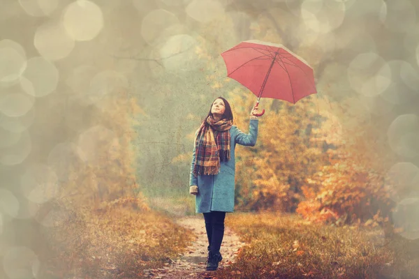 Brunette girl with umbrella — Stock Photo, Image