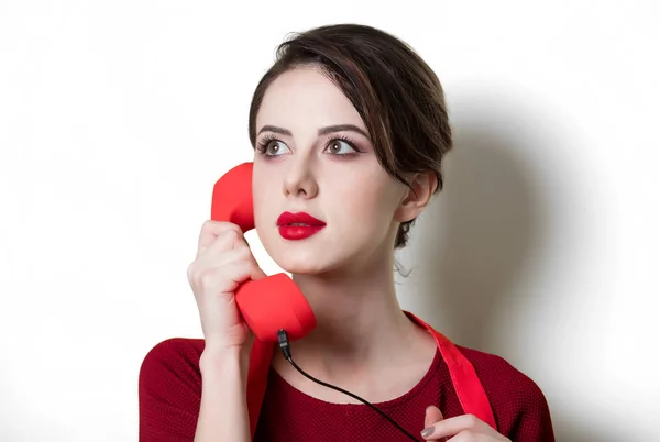 Young housewife with handset — Stock Photo, Image