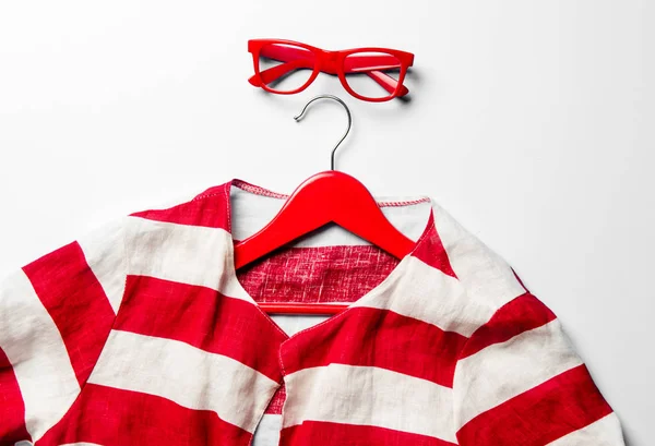 Jacket, hanger and glasses — Stock Photo, Image