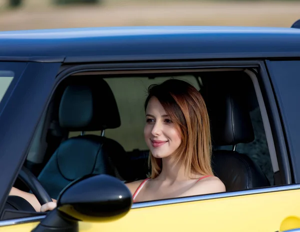 Young girl sitting in car — Stock Photo, Image